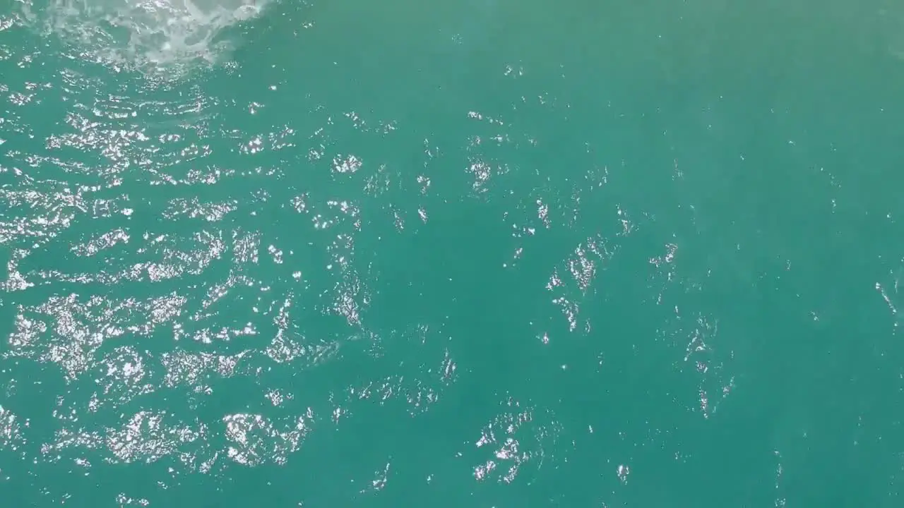 Aerial look down view of clear turquoise ocean