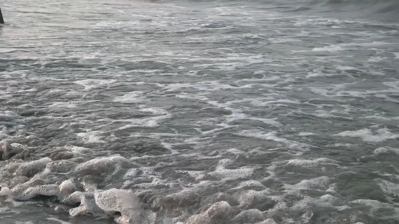 4k close up of waves on the beach