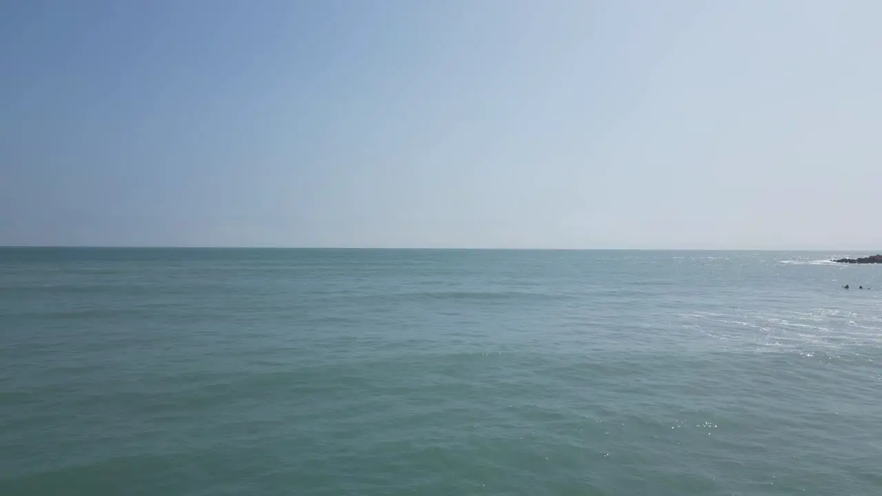 Slow aerial shot of the sea with floating