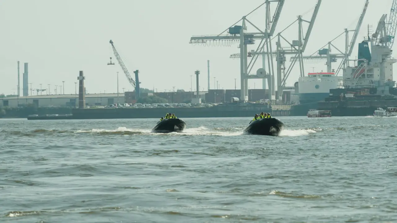 two sightseeing RIBs driving on the elbe in Hamburg