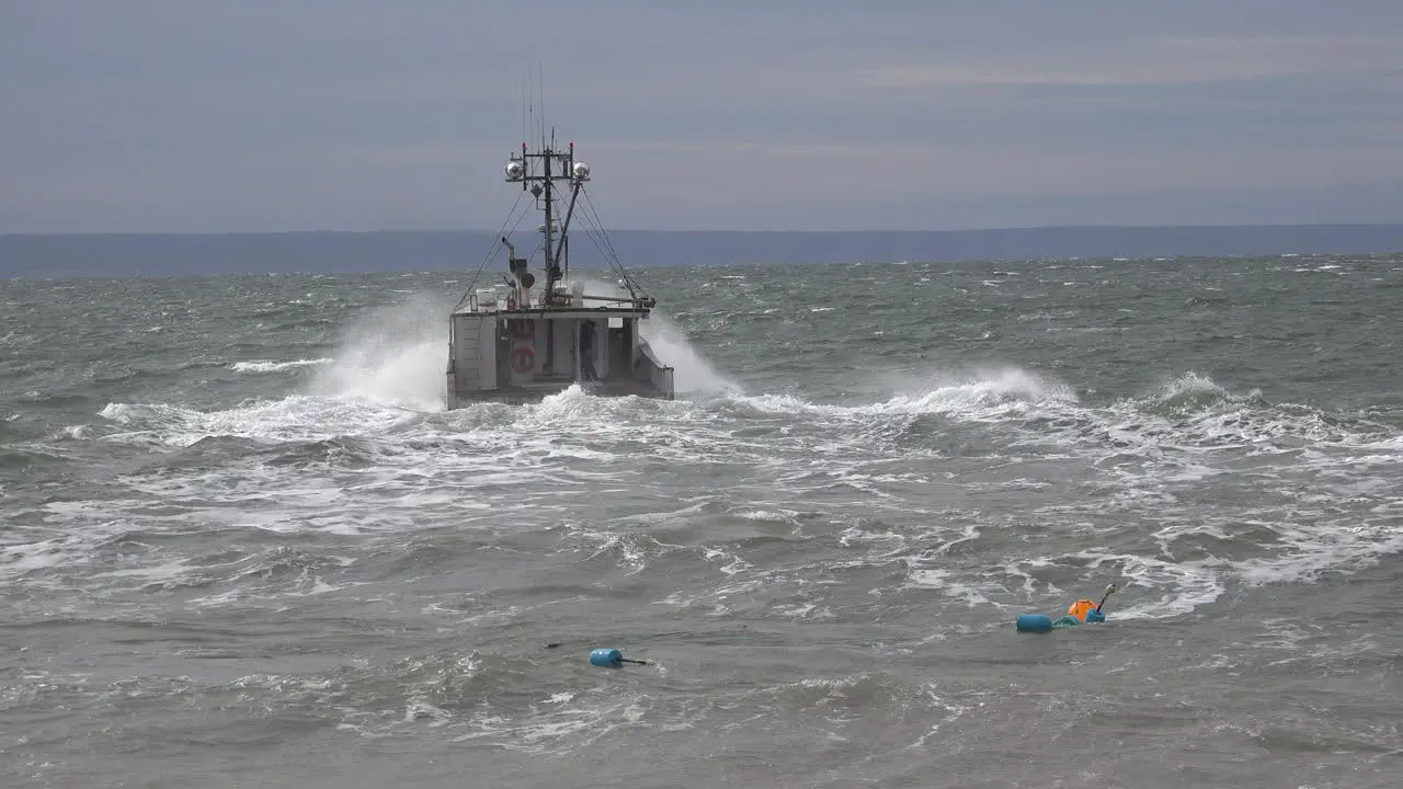 Canada Bay Of Fundy Boat Moves Out Across Choppy Waves