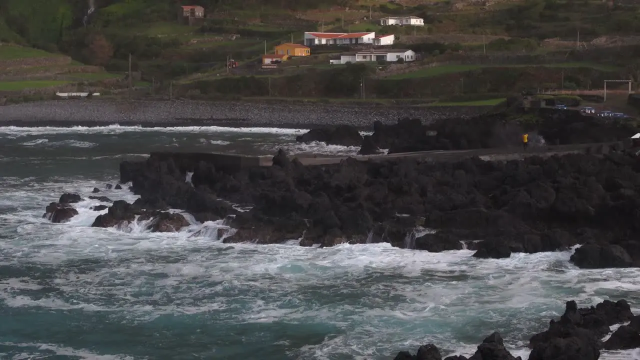 Aerial tilt up shot of rough sea at Flores island Azores Portugal