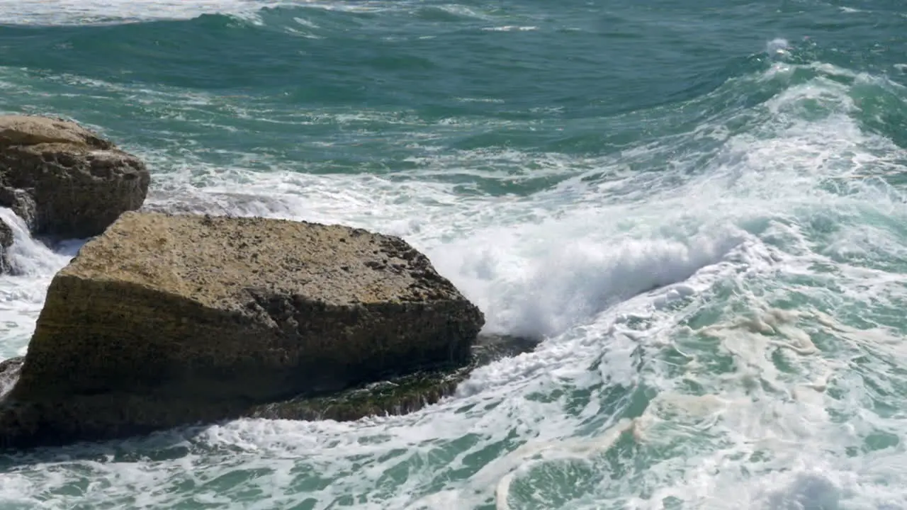 Sea and rock meeting with big splashes