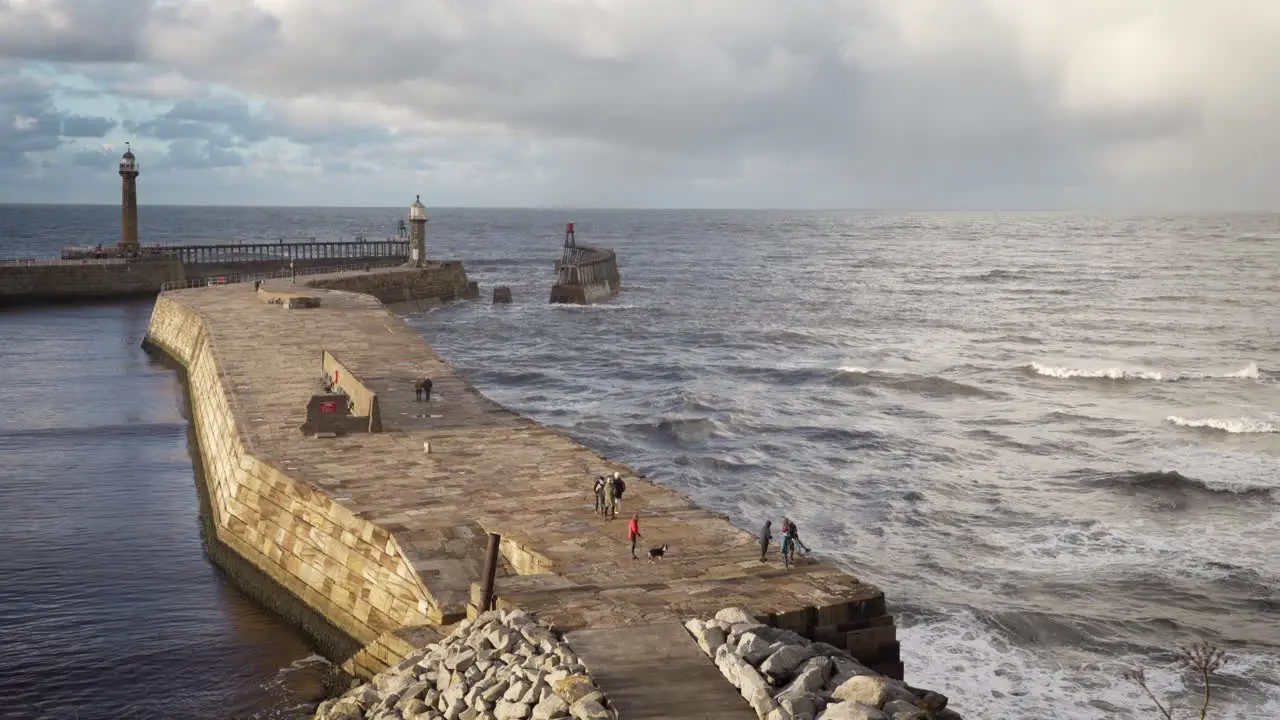 East Pier at Whitby with stormy sky and rough sea