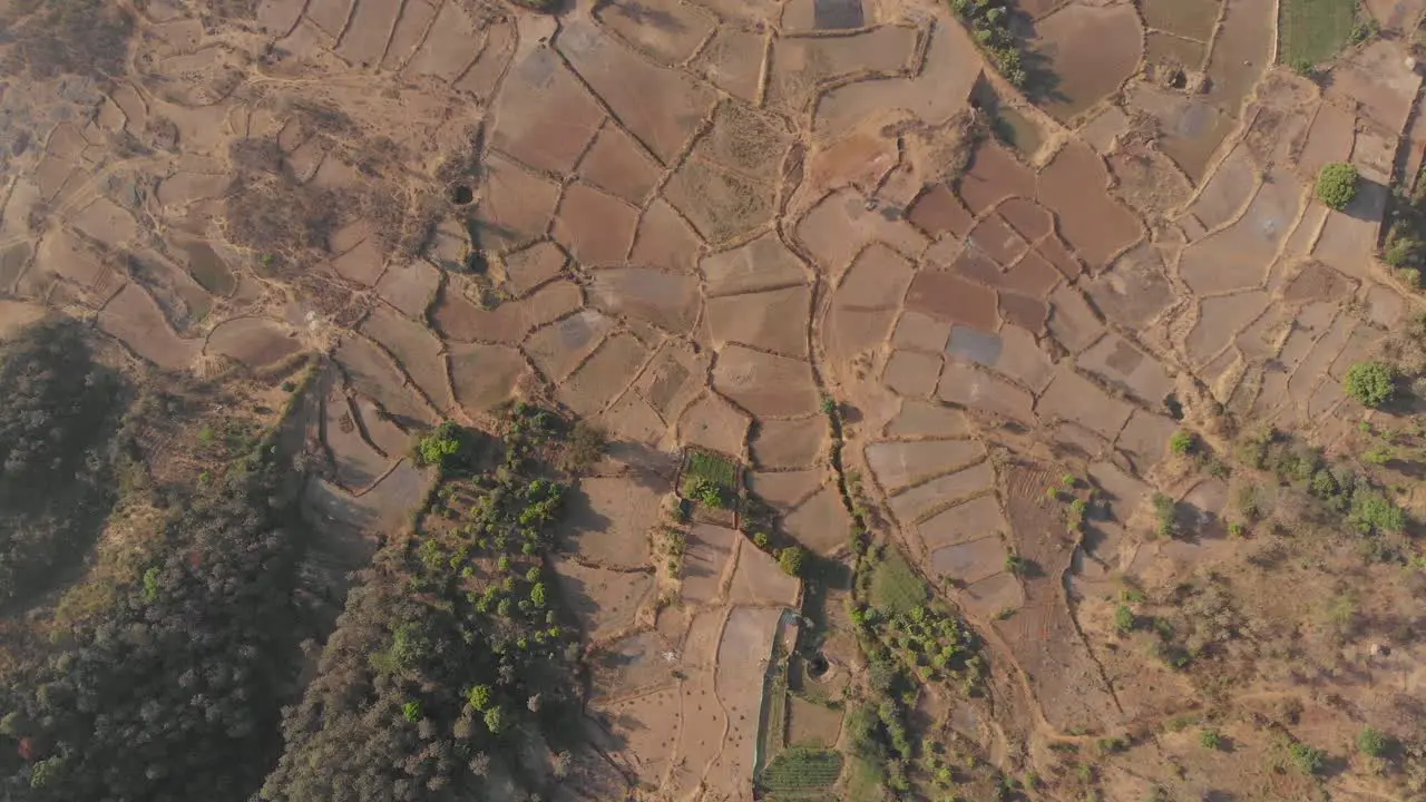 Top down drone shot of dry Indian farmlands