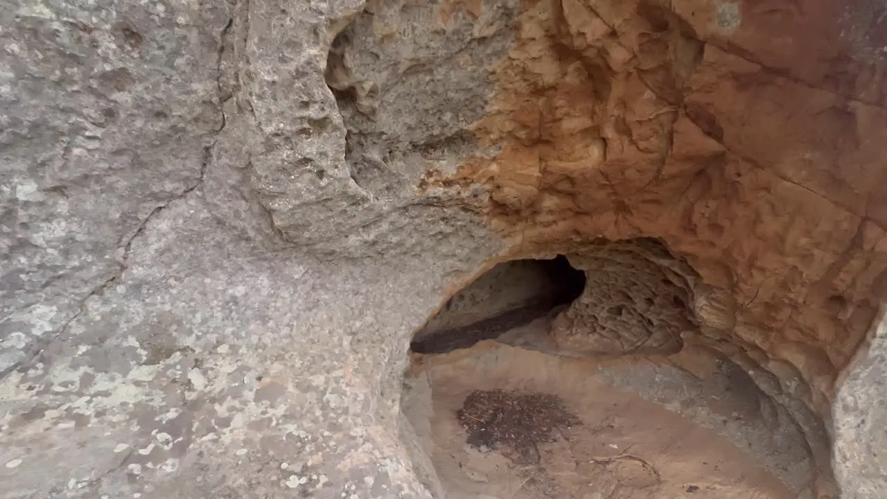 Getting out walk from inside the cave stony and rocky surface of an old-time structure raw natural ambiance