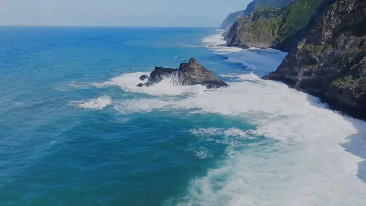 Blue ocean waves hits the rocks on the seaside