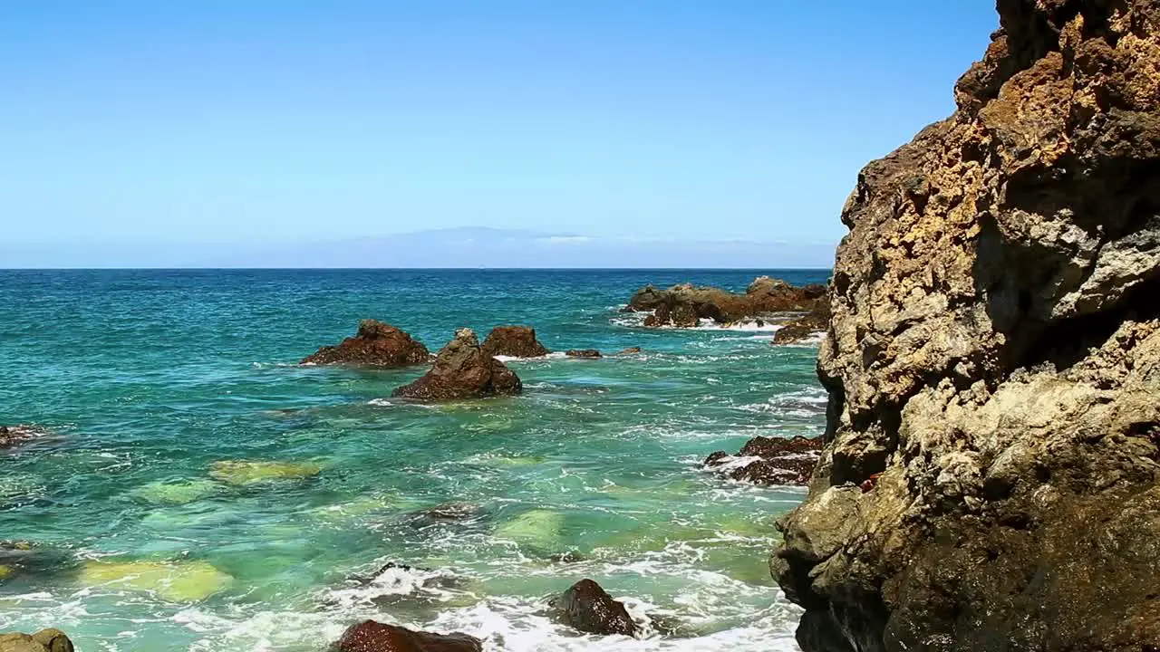 Shot of the rocky volcanic sea coast of Tenerife on a hot summer day