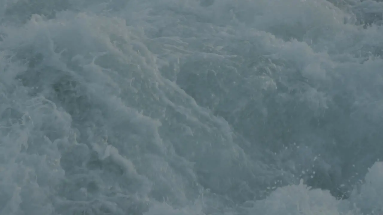 Slow motion shot of water churning from a vessel underway