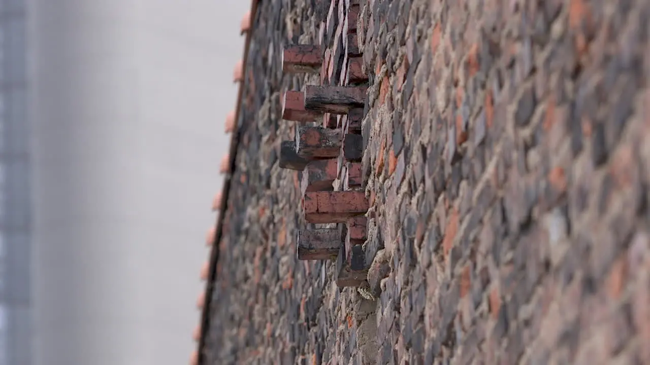 Abstract brick wall with protruding bricks