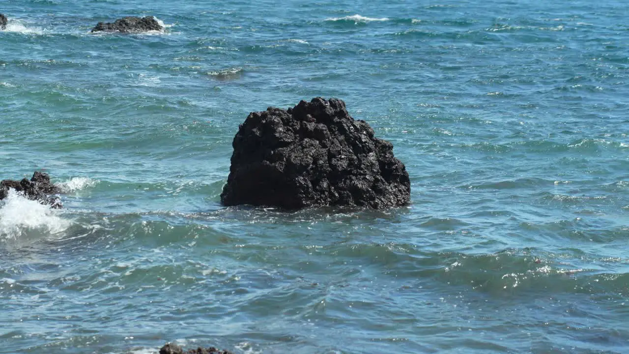 Isolated Volcanic Rock in Turbulent Sea Waters off Tenerife Coast