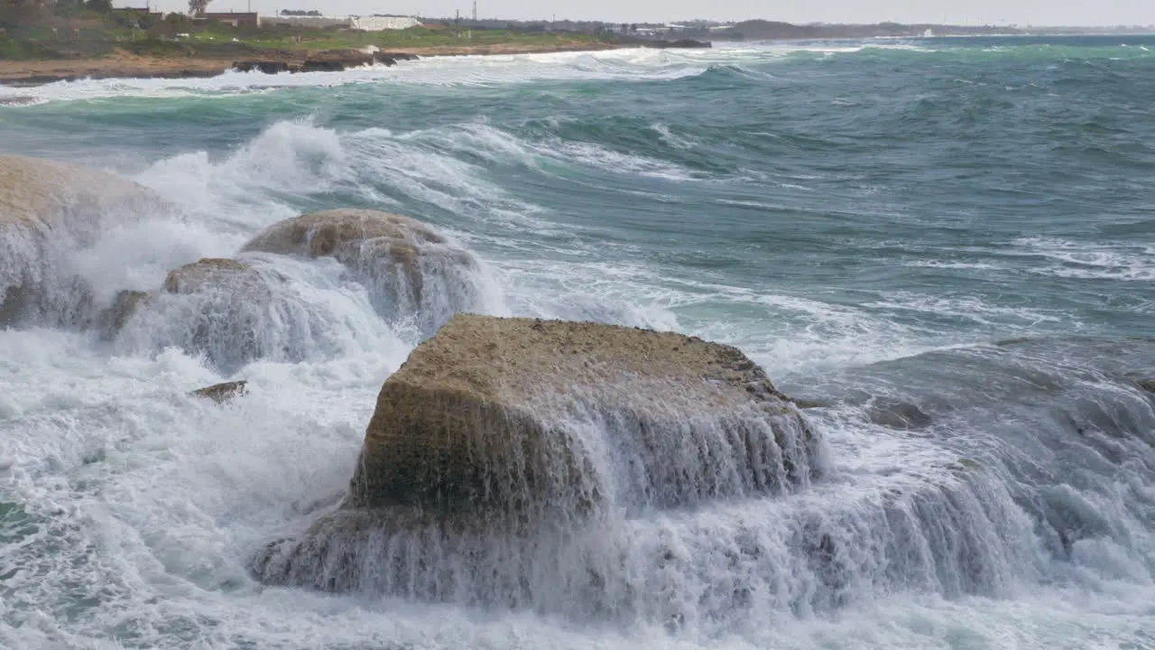 Rosh Hanikra coastline and sea waves crushing rocks