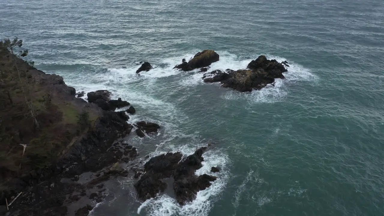 Aerial view of jagged rocks in the middle of the Pacific ocean