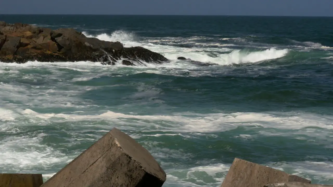 The Atlantic ocean from a breakwater in South Africa with choppy seas