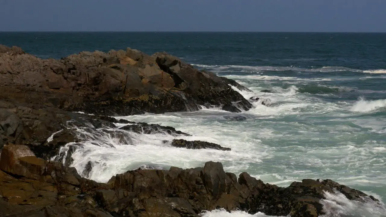 Waves break over the rocky shoreline on the Atlantic coast