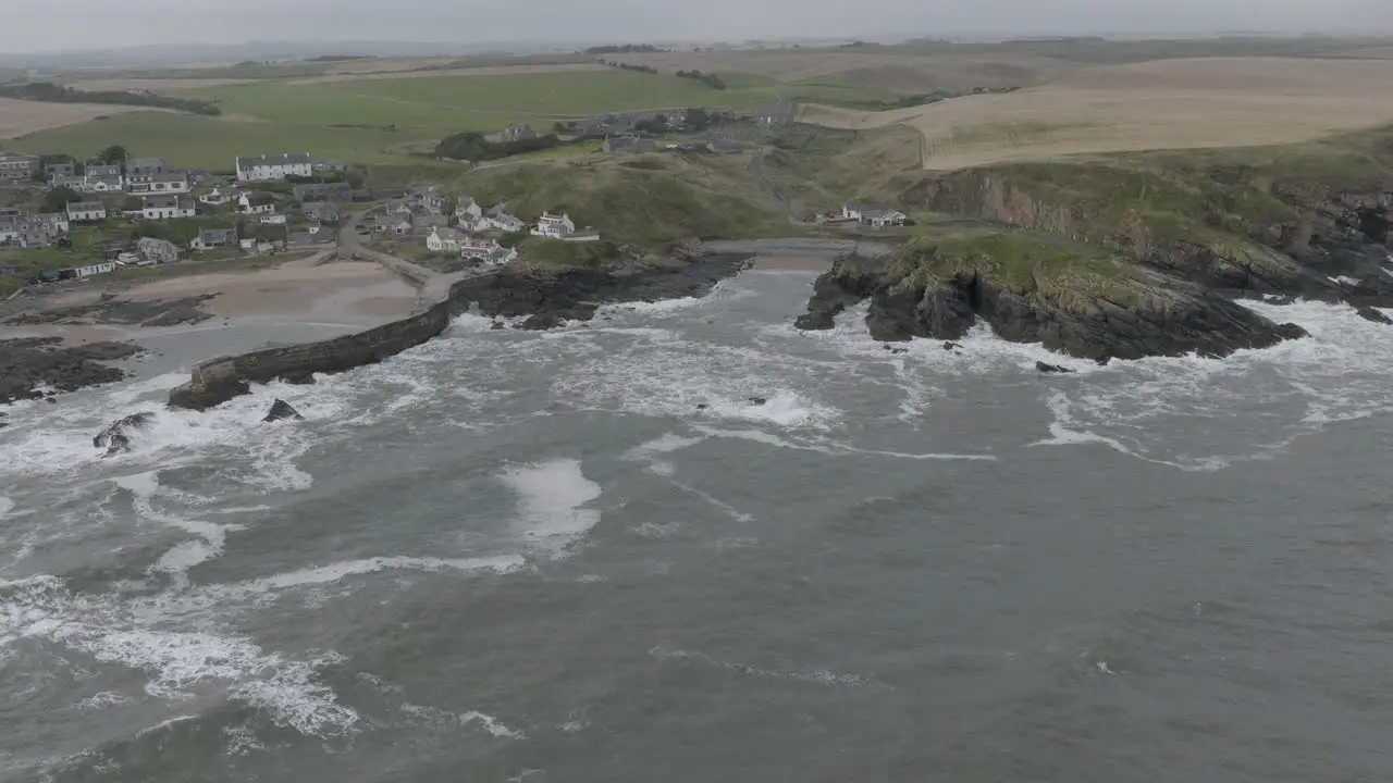 Collieston Harbour aerial orbital looking towards the village from the sea