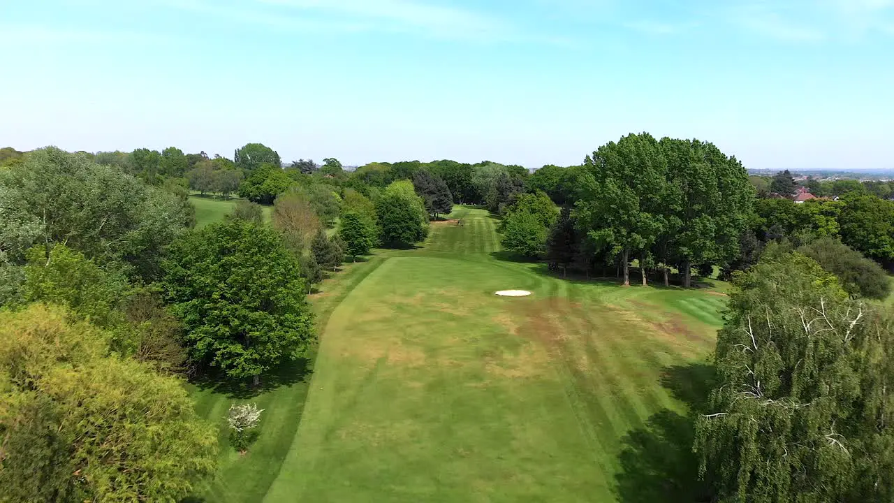 Reverse Aerial Flyover of Golf Course and Fairway