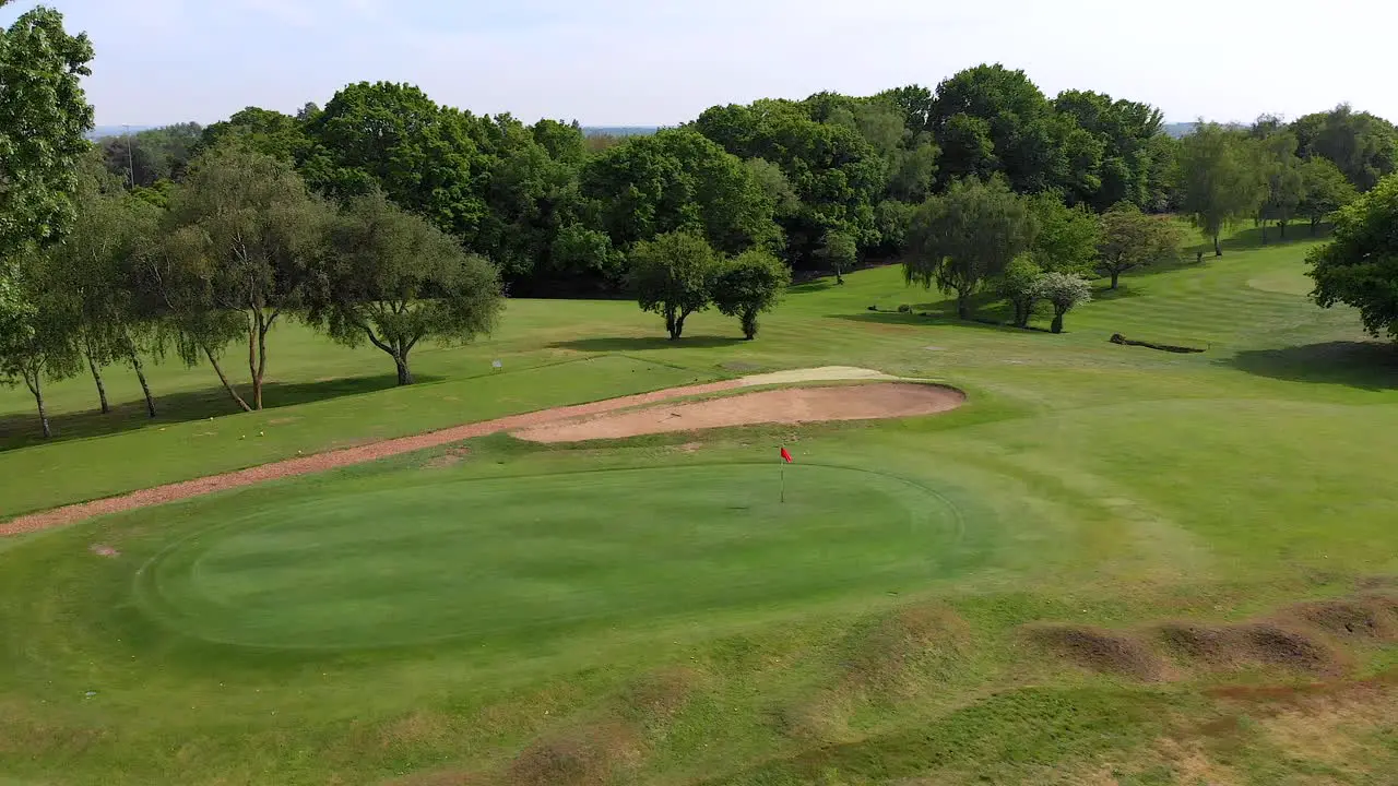 Smooth Aerial Orbit over Golf Putting Green the Rough and Bunker