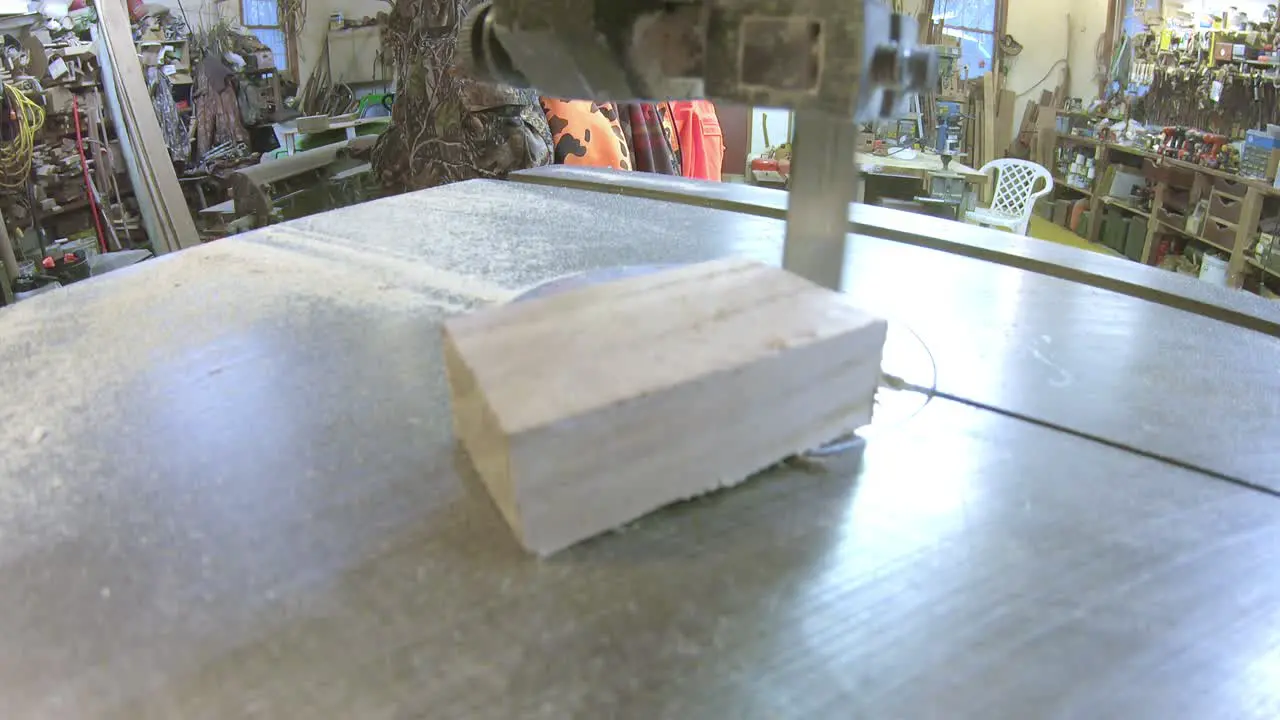 Using a bandsaw to cut small blocks of wood