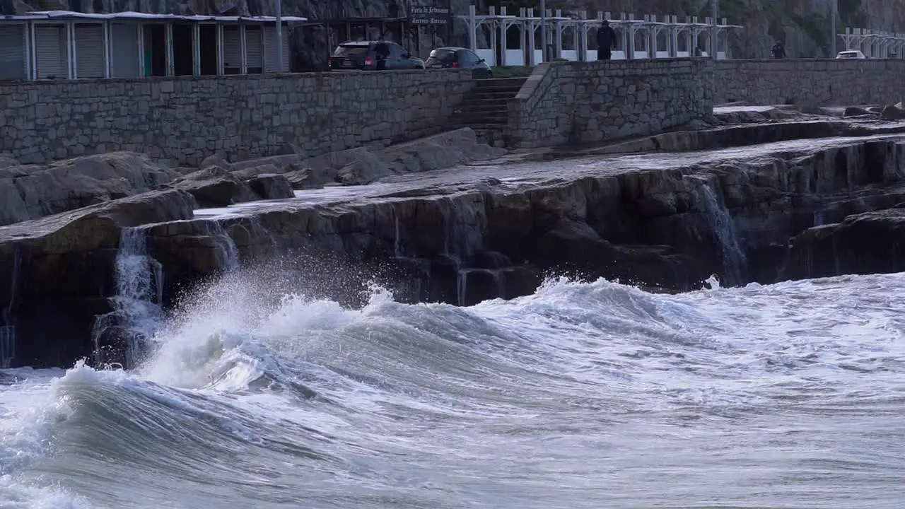 View of a wave breaking onto a rocky coast in Mar del Plata Argentina