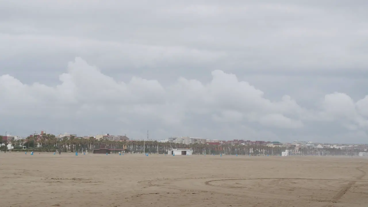 Panorama of city beach in Valencia and rough sea Spain