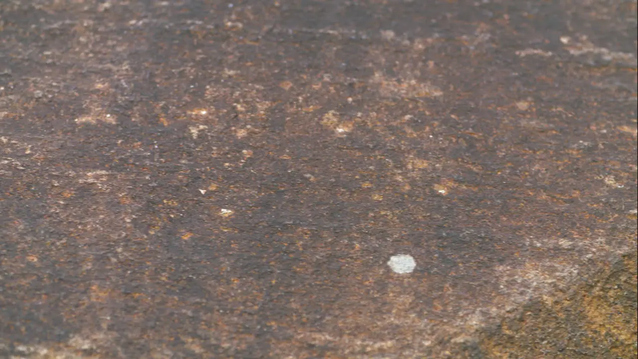 Pan across a granite rock surface