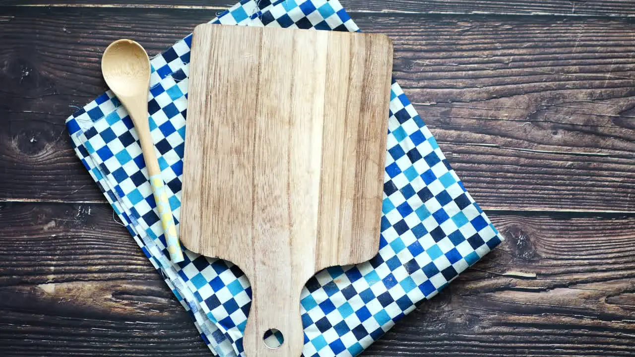 Wooden chopping board on table