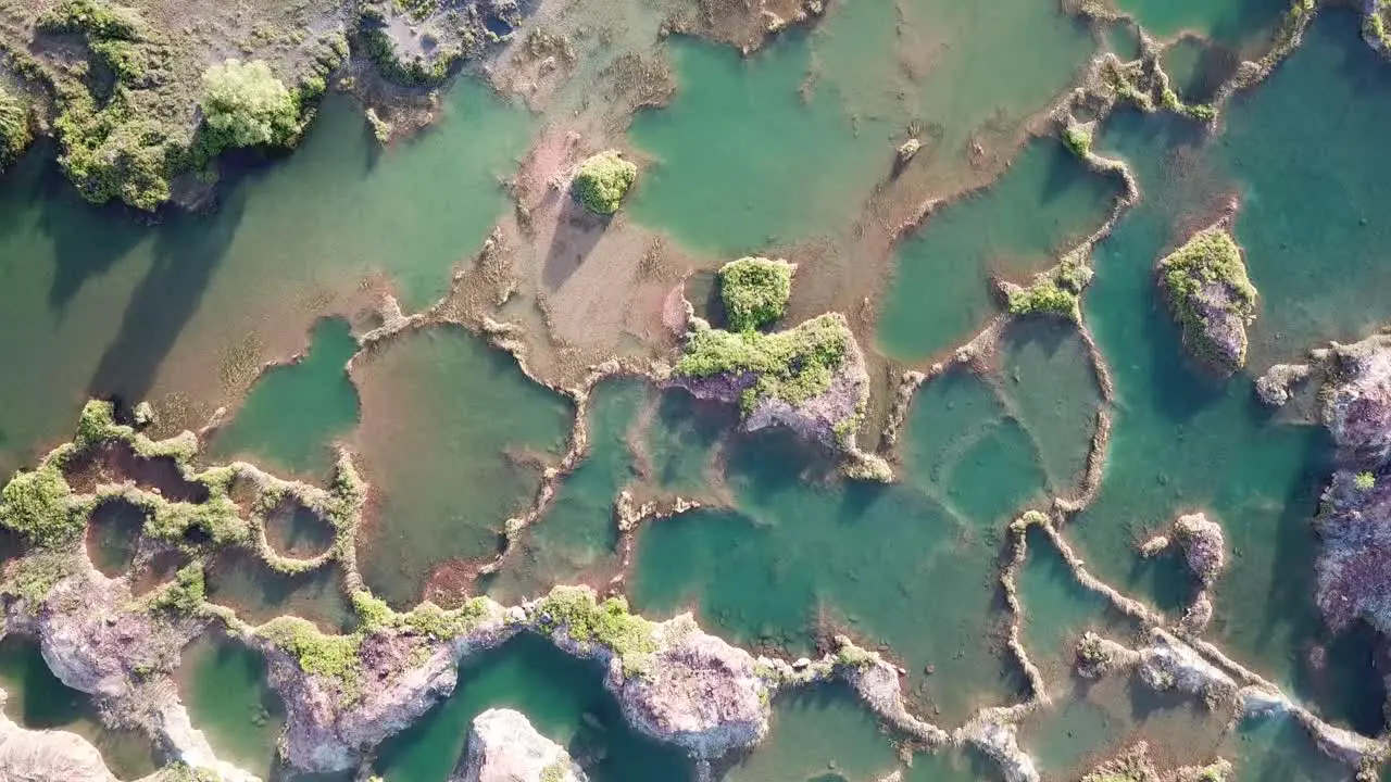 Aerial view hidden gem blue quarry surrounded by red cliff