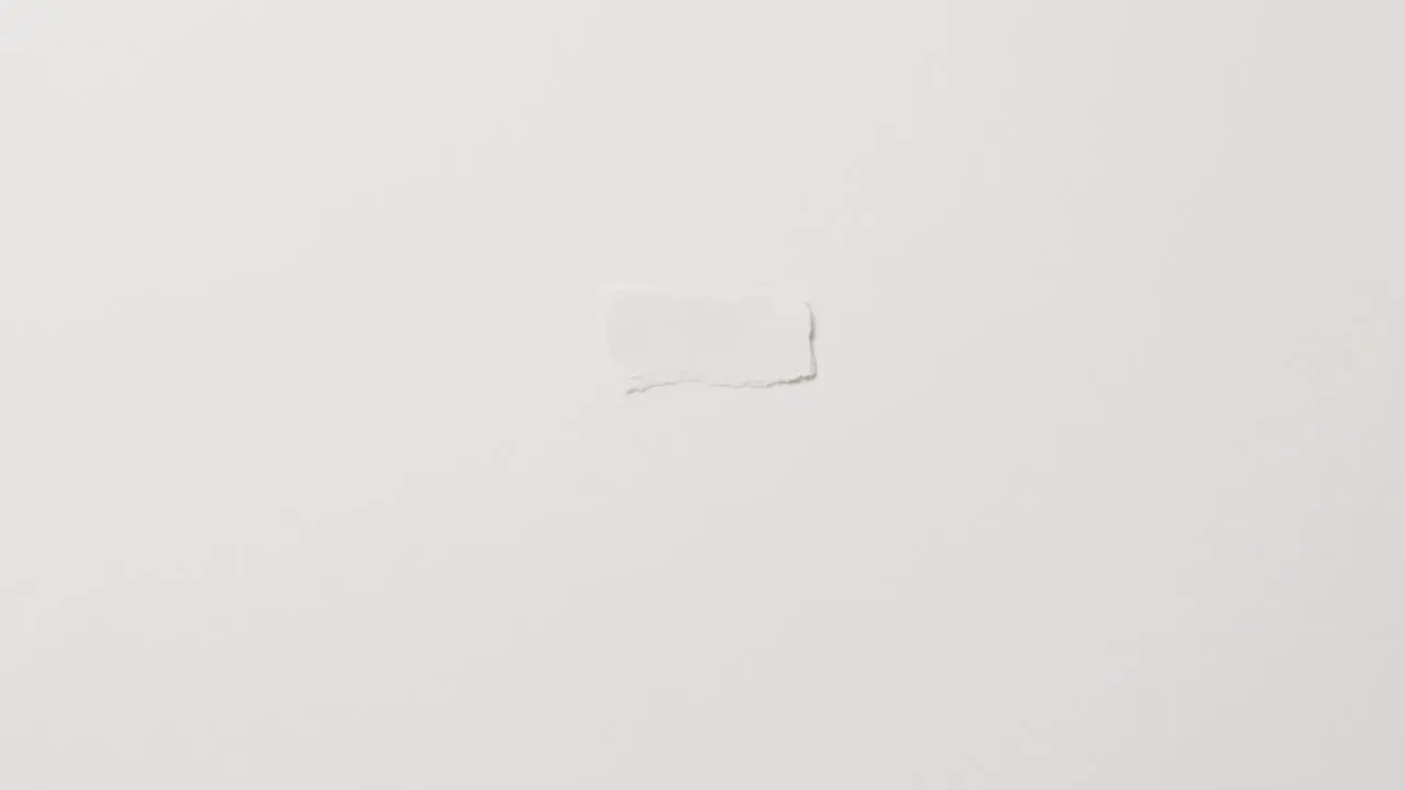 Video of close up of torn piece of paper with copy space on white background