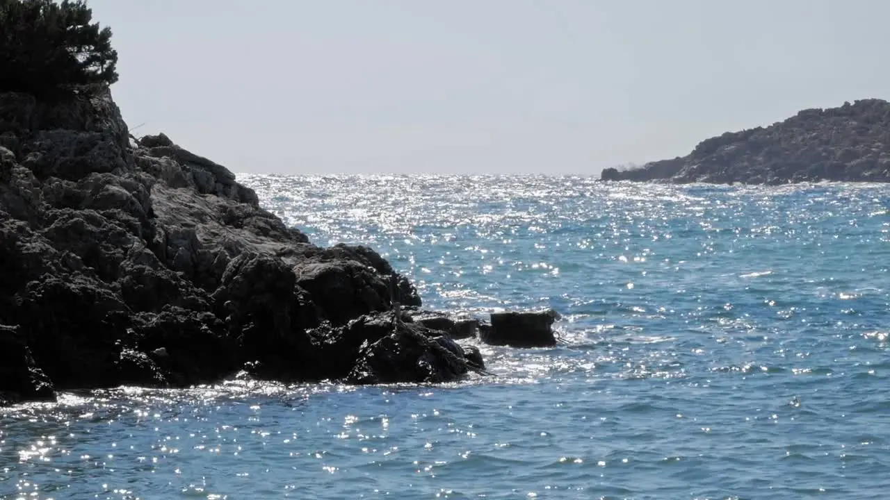 Glistening Ocean Water At Jerusalem Beach In Greece wide static shot