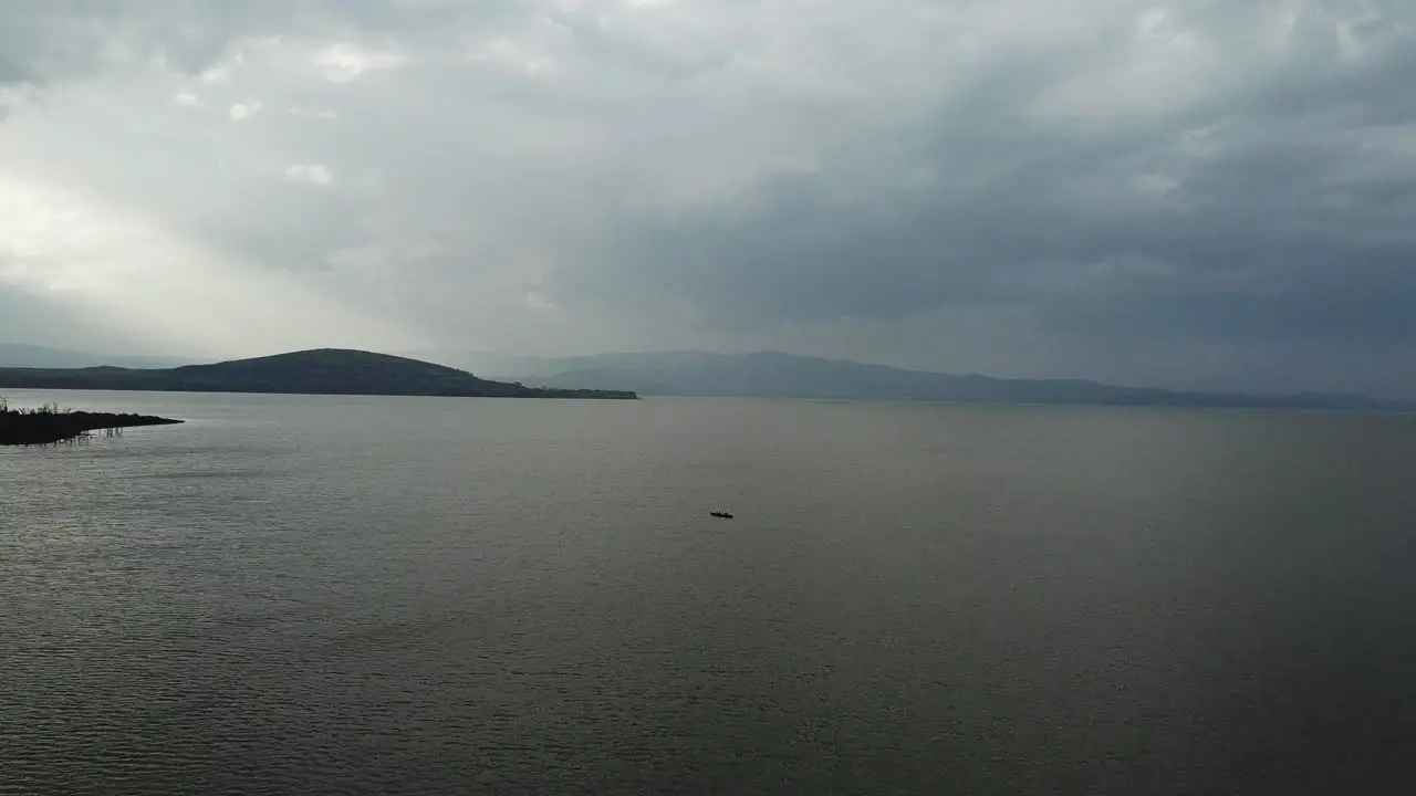 Drone view of a ship alone in the middle of the sea