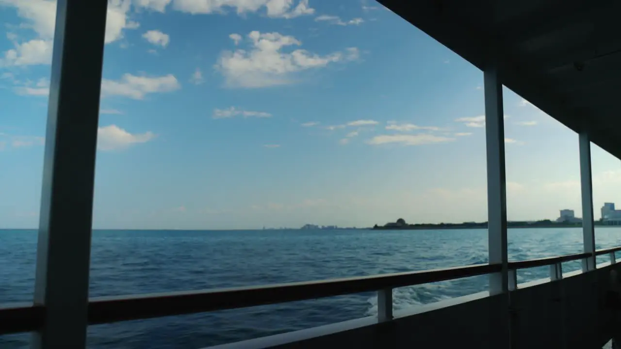 Ocean ripples with small waves as large boat cruises through the sea