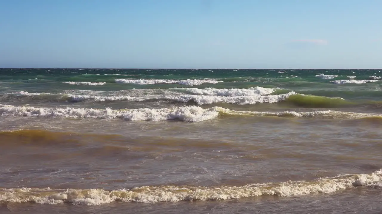 Slow motion ocean waves on a clear windy day