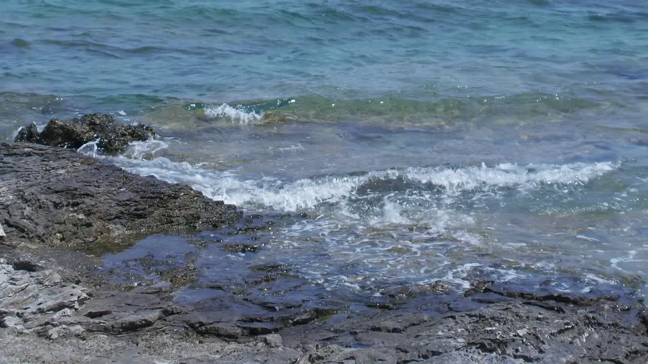 Splashing sea waves at rocky coast of Croatia