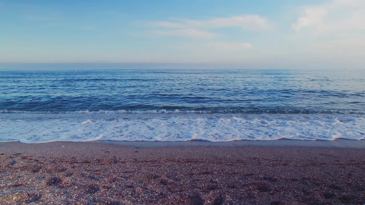 Ocean waves on the Mediterranean sea near sunset