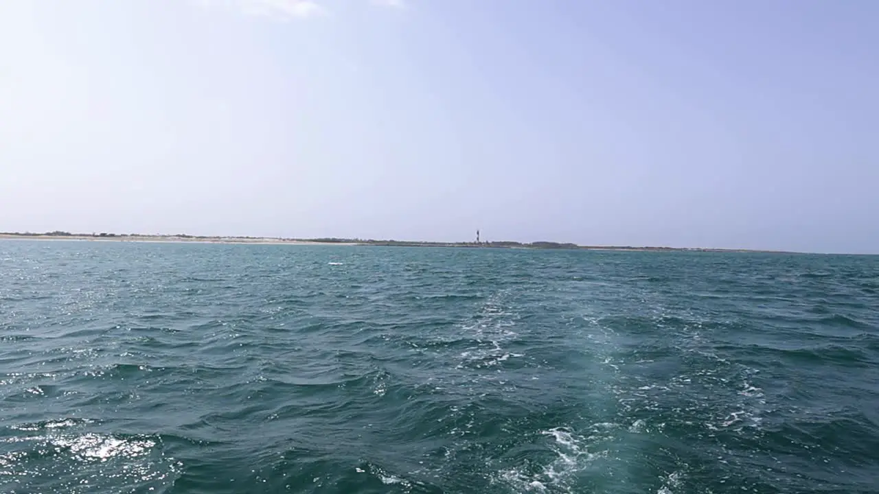 Waves on blue sea behind the speed boat water in sunny day