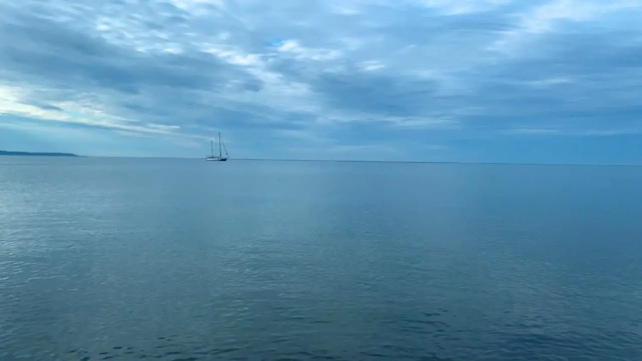 Lonely ship on calm sea small waves and clear blue water Baltic Sea in Poland Rewa