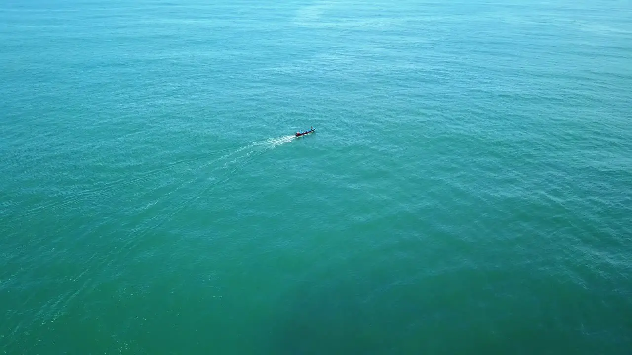 Aerial view of traditional fisherman with boat cruising on sea for fishing in Asia