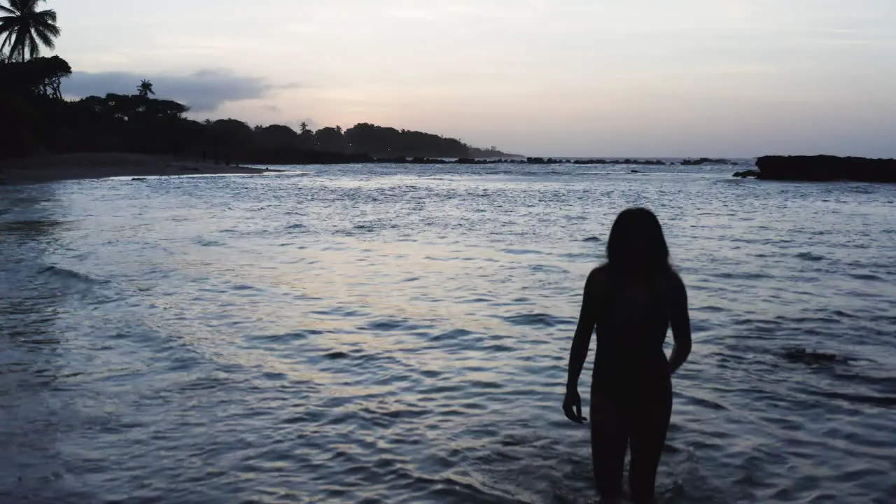 Silhouette of Woman Walking on Tropical Beach in Dominican Republic