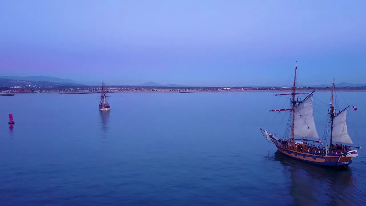 Spectacular aerial of a tall sailing ships on the open ocean at sunset 3