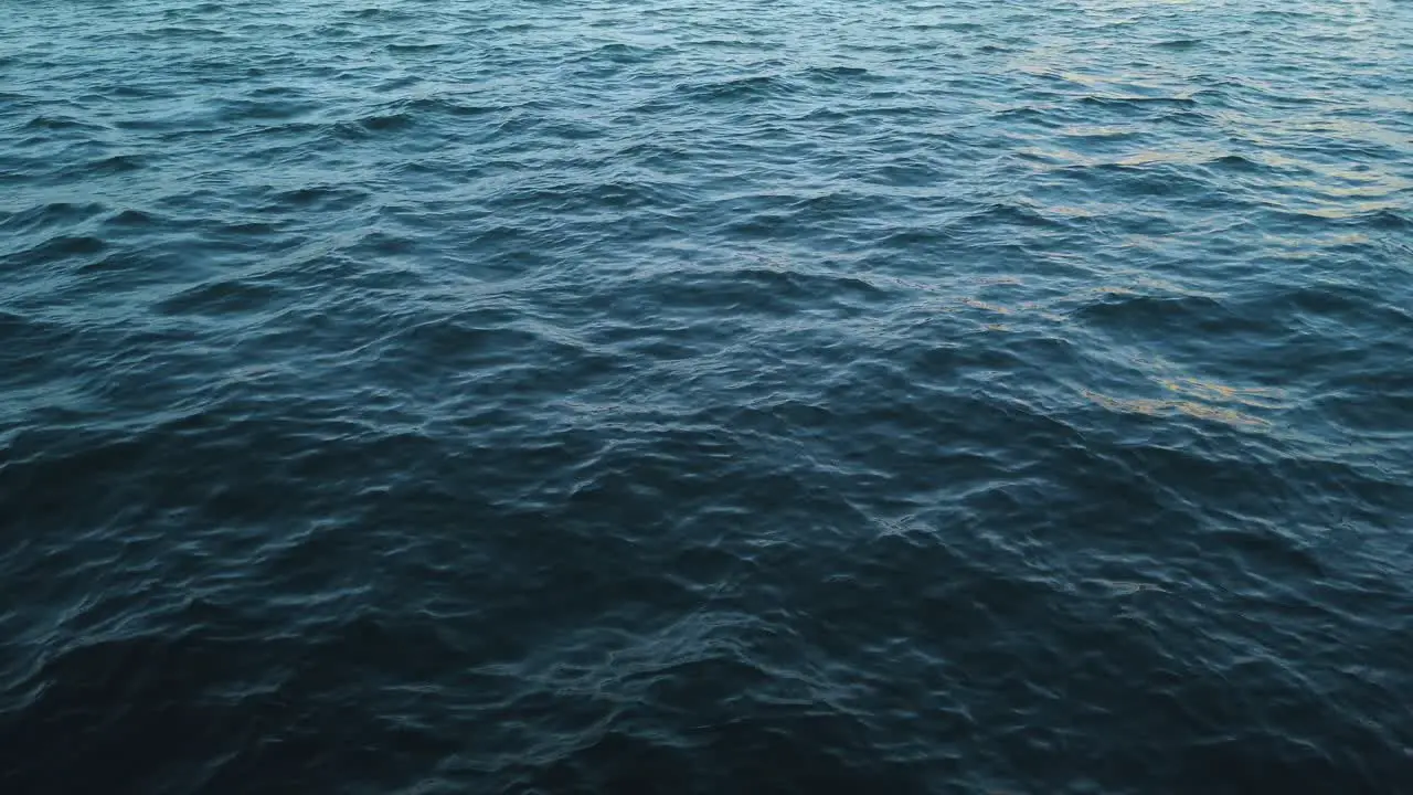 Scenic View Of A Wavy Seascape During Sundown In Summer