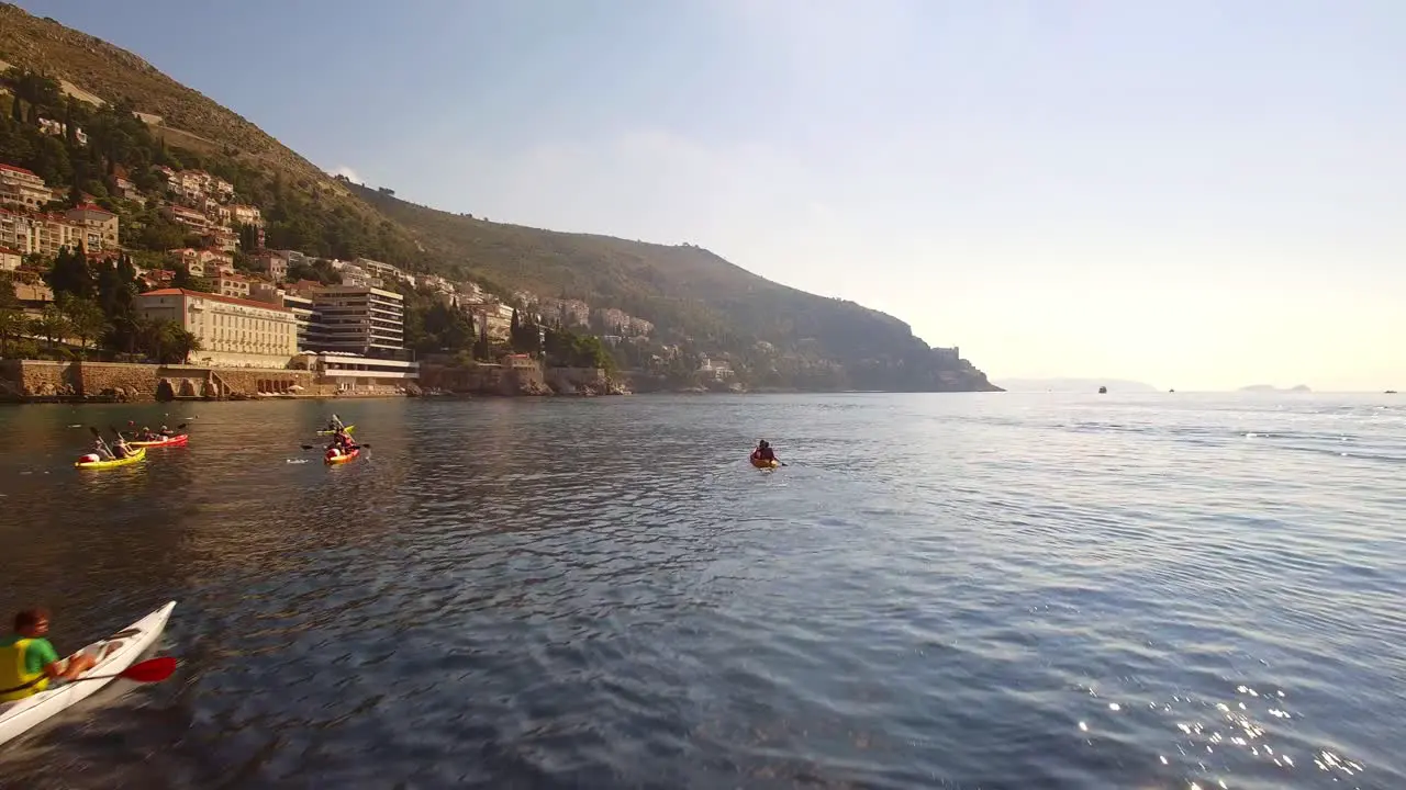 People kayaking in sea near Dubrovnik