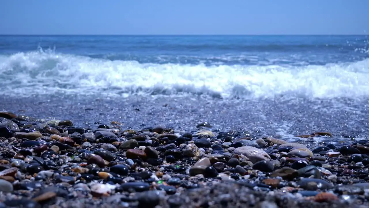 Mediterranean Sea Waves Crashing On Rocky Coastline Of Beach