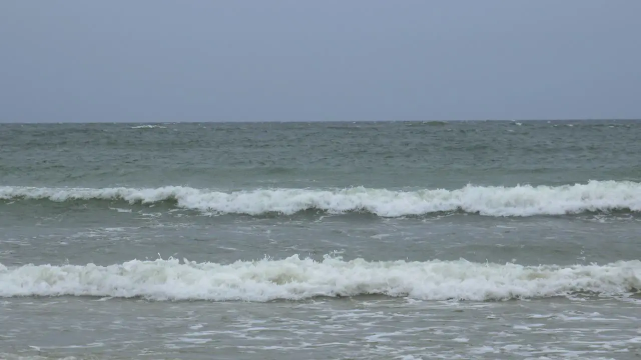 Waves crashing into shore of baltic sea in sopot