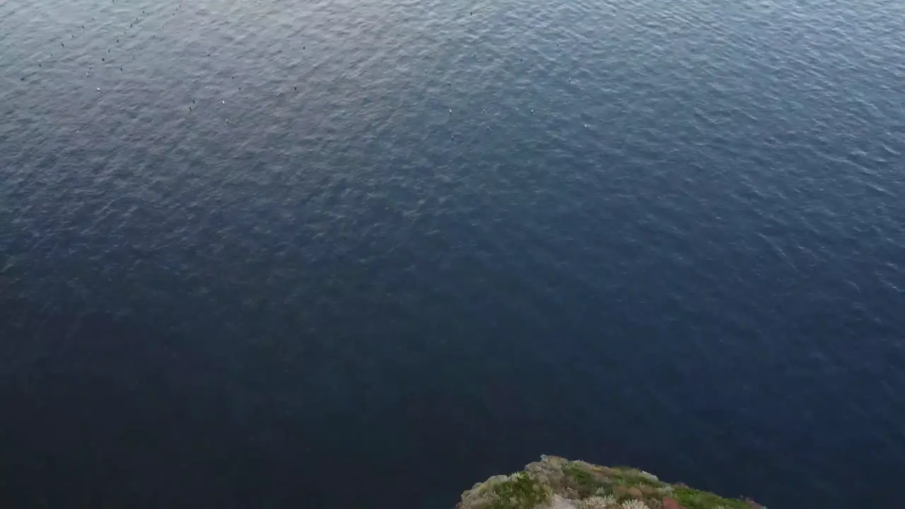 Flying over a mountain to the sea