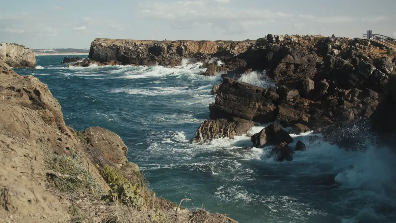 Huge waves splashing against cliffs