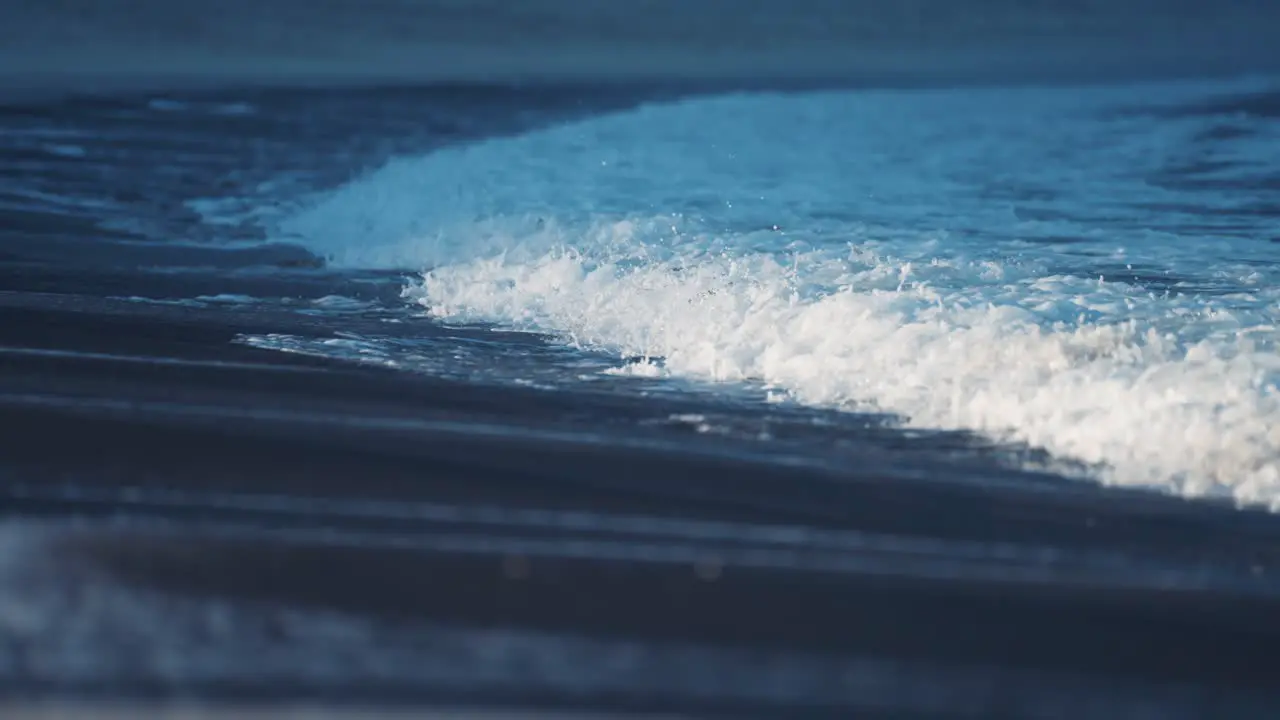 The powerful waves break on the sandy shallows on the Ersfjord beach