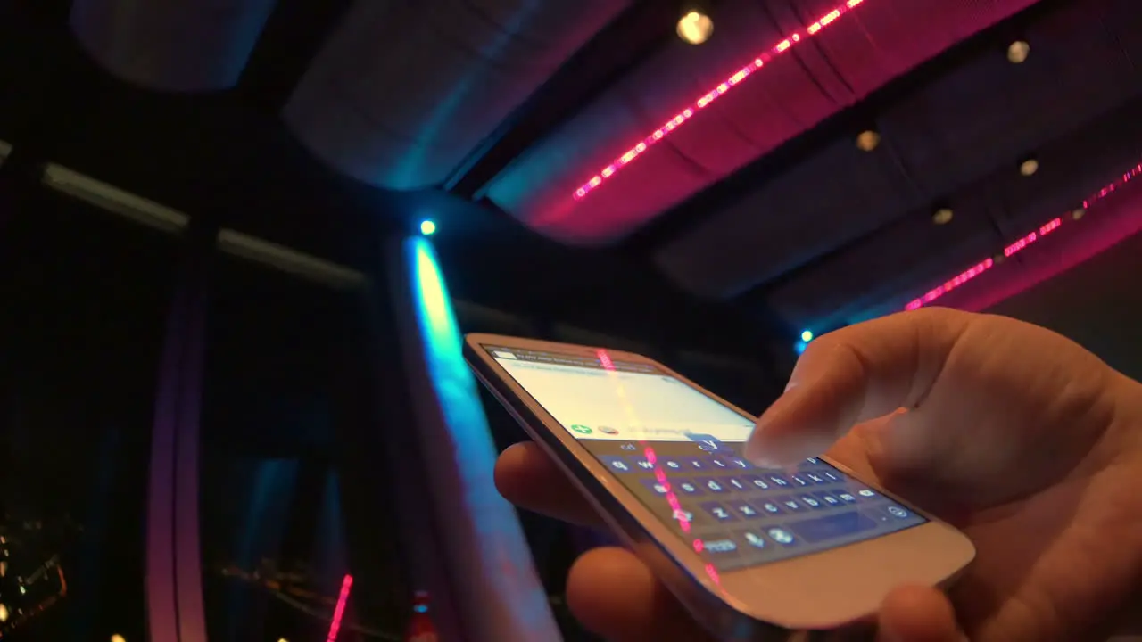 Typing sms at nightclub