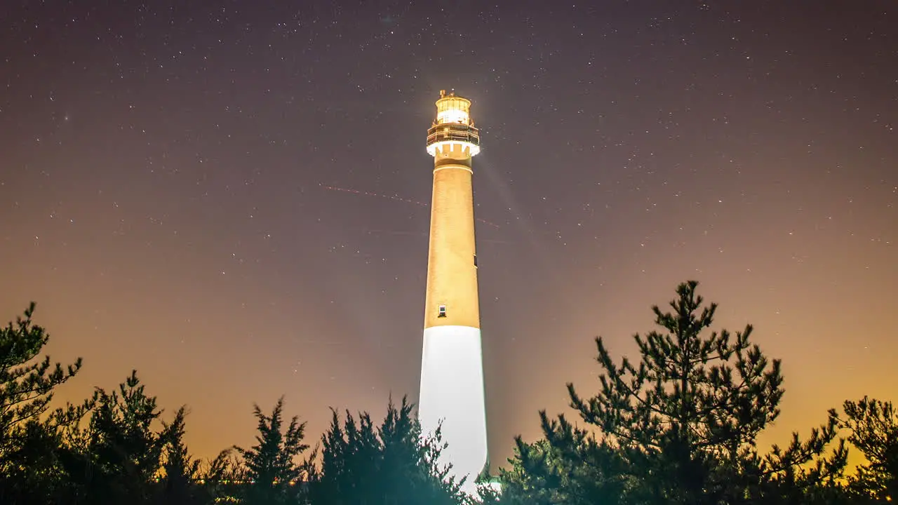 Timelapse of stars moving across the night sky behind the historic Barnegat Lighthouse