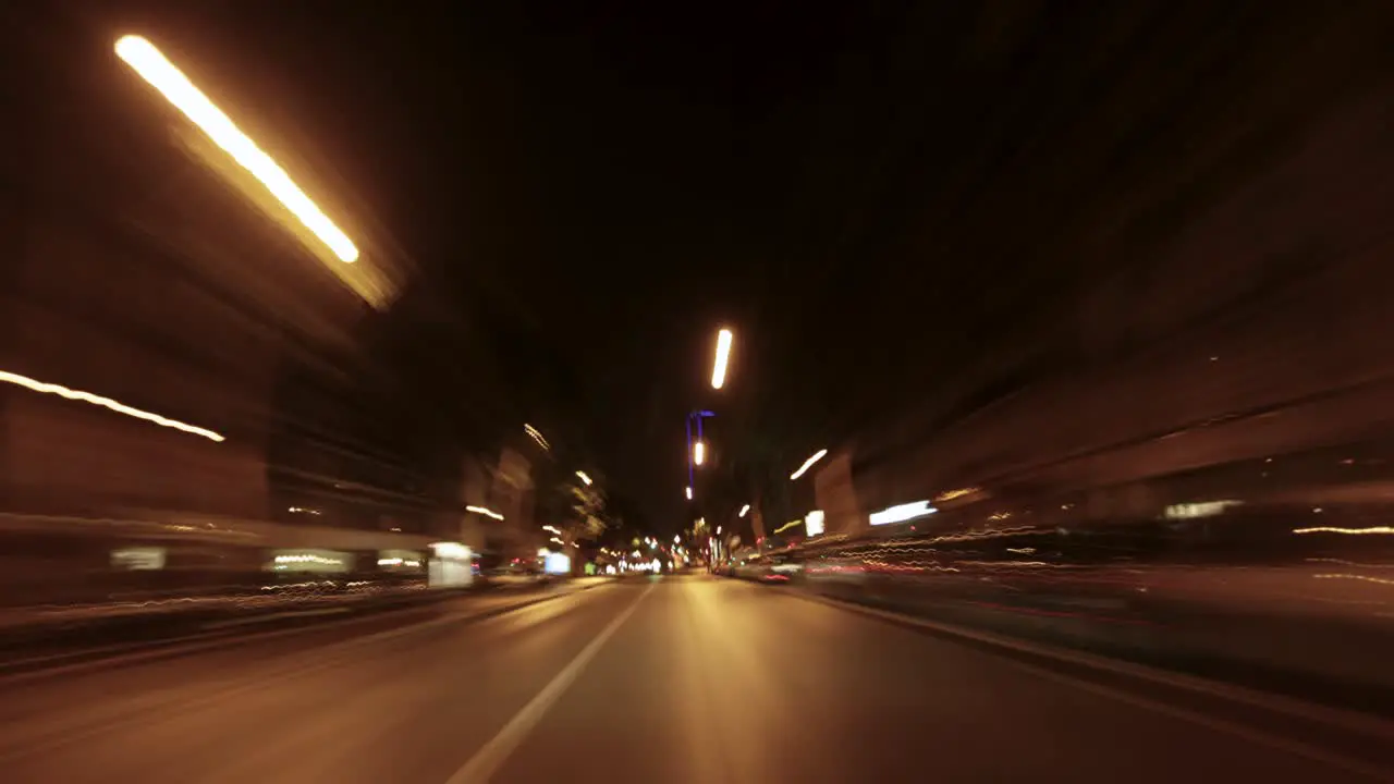 Late night car ride timelapse through Paris France with cars building lights and street lights illuminating the scene